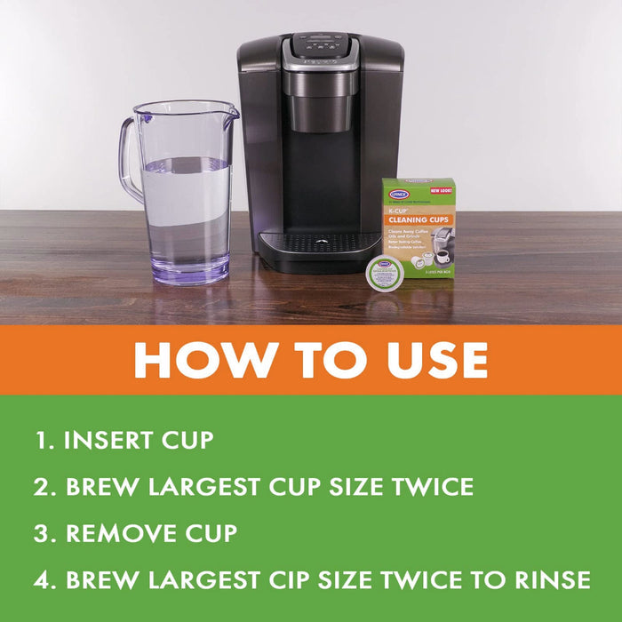 Urnex K-Cup cleaning cups packaging, jar of water, and coffee machine with how to use cleaning cups placed on a wooden surface