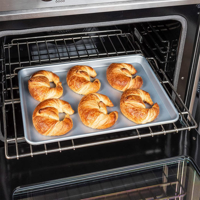 Viking Nonstick Baking Sheet Pan, Aluminized Steel, 0.88 mm Gauge with cooked croissants in the oven