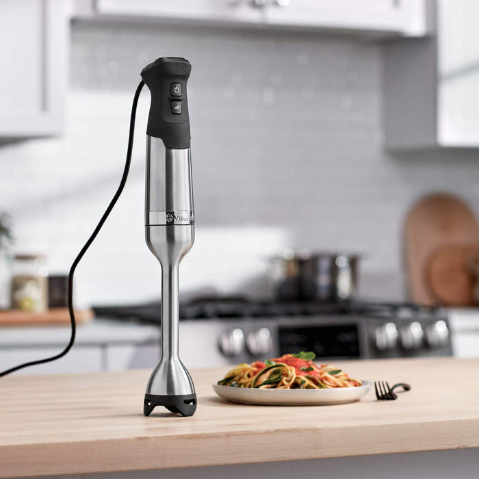 Vitamix Immersion Blender next to a plate of stir fry in a kitchen setting
