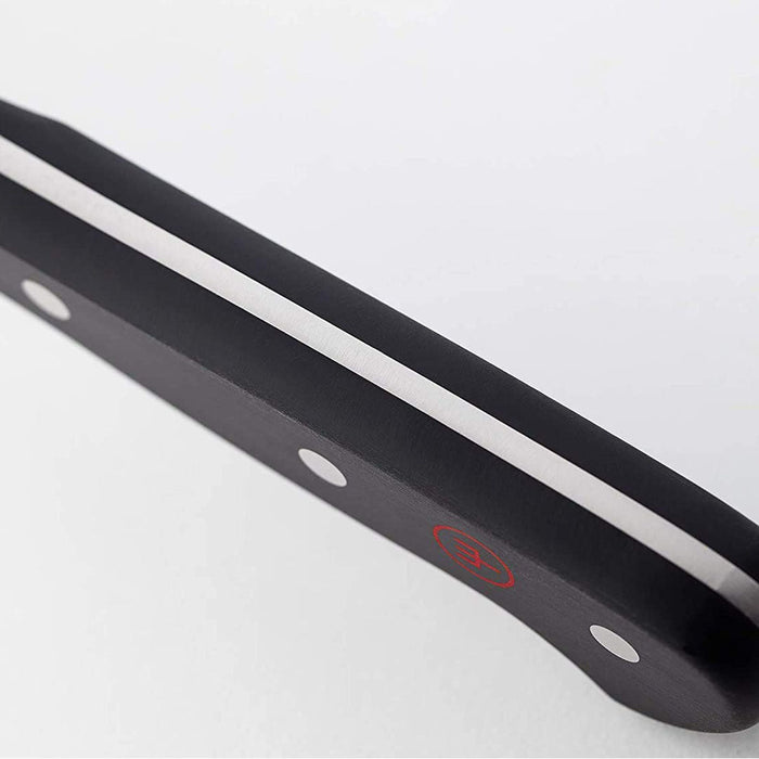 Close up of handle of 4.5 inch Wusthof classic asian utility knife displayed on a white background