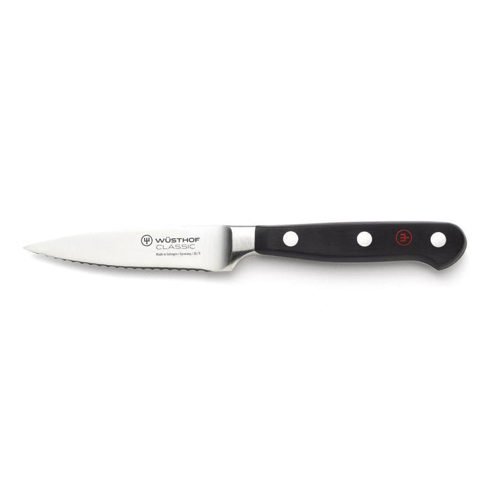 Wusthof Classic Fully Serrated Paring Knife - 3.5″ displayed horizontally on a white background