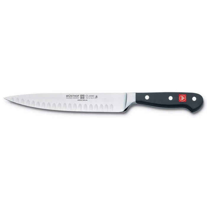 8 inch Wusthof Classic Hollow Edge Carving Knife displayed horizontally on a white background