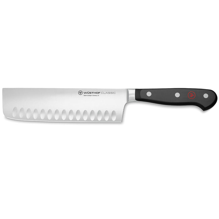 7 inch Wusthof classic hollow edge nakiri knife displayed horizontally on a white background