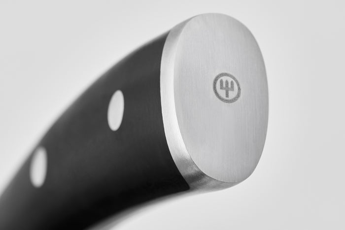 Close-up of a knife handle with a brand logo on a light gray background