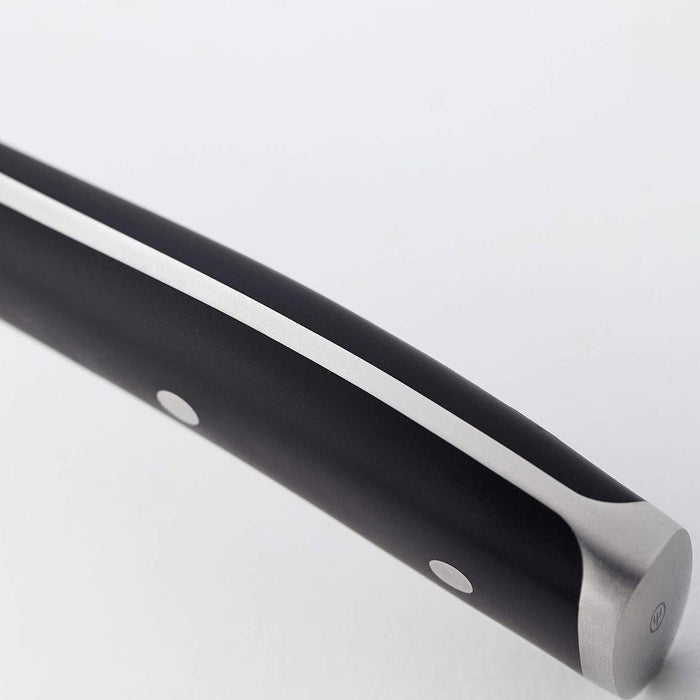Close up of handle of Wusthof Classic Ikon Curved Peeling Knife (2.75") displayed on a white background