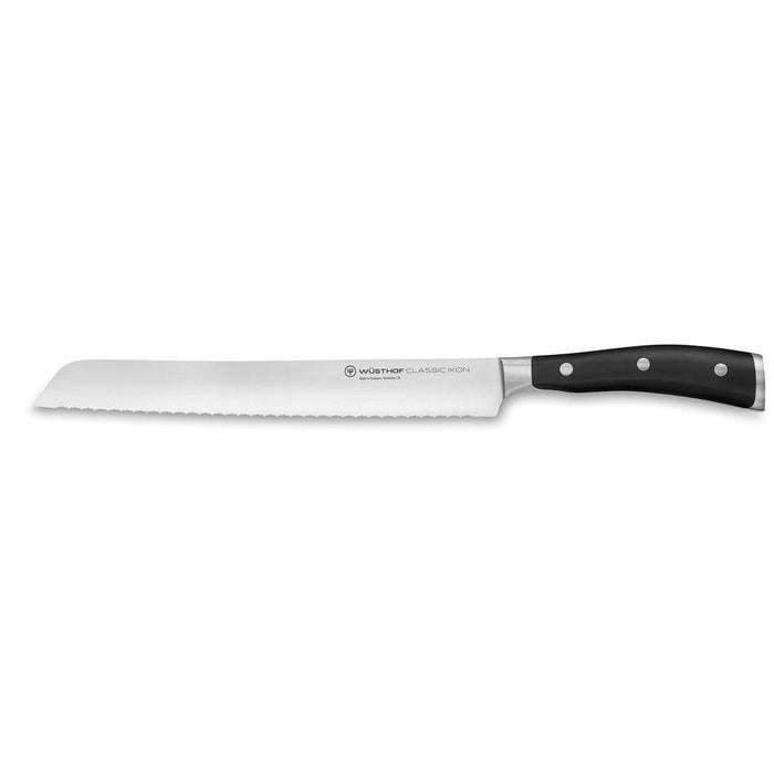 Wusthof Classic Ikon Double Serrated Bread Knife - 9″ displayed horizontally on a white background