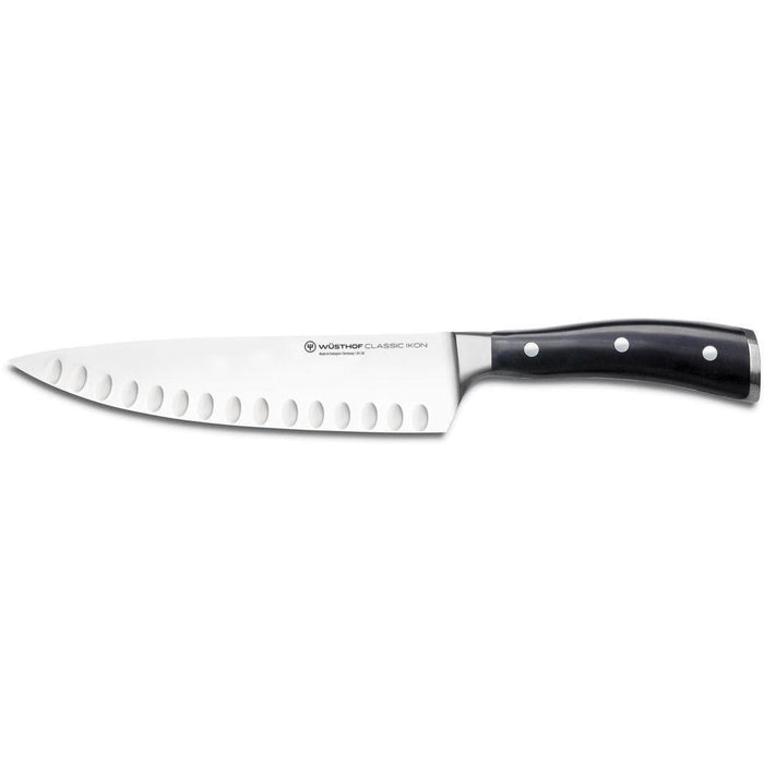 8 inch Wusthof classic ikon hollow edge cook knife displayed horizontally on a white background