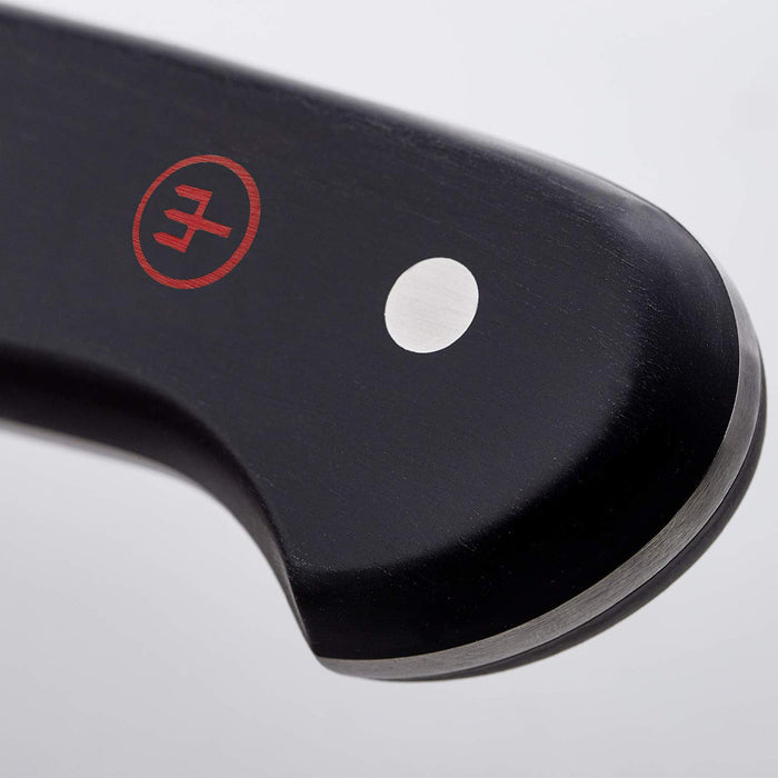 Close up of a 5 inch Wusthof classic soft cheese knife's handle displayed on a white background
