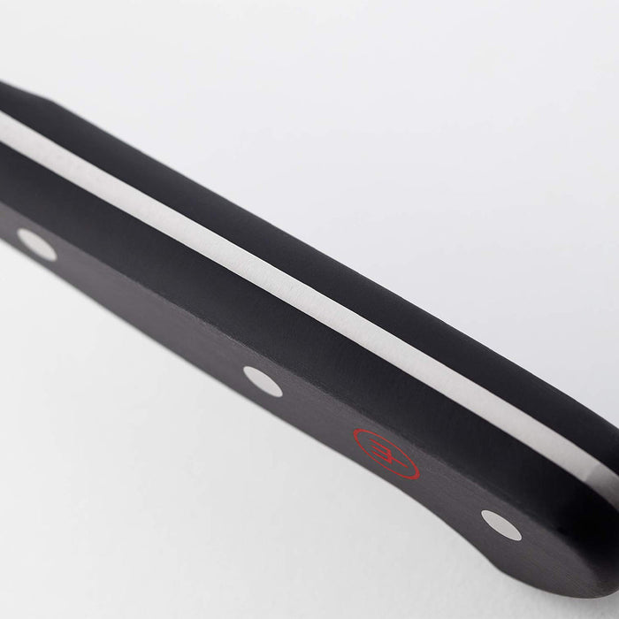 Close up of handle of 5 inch Wusthof classic soft cheese knife displayed on a white background