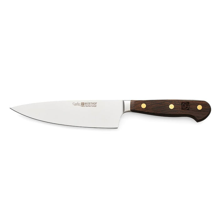 A 6 inch Wusthof Crafter Series chef's knife with a stainless steel blade and a wooden handle.