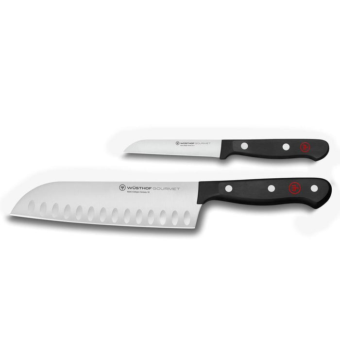 A set of two Wusthof Gourmet knives with black polyester handles and stainless steel blades, including a 4-inch utility knife and an 8-inch cook knife.