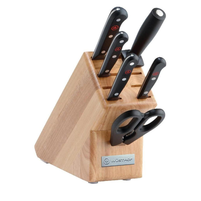 Wusthof Gourmet 7-piece starter knife block set, with a beechwood knife block and black synthetic handles, displaying various knives with their blades visible and the brand's logo.