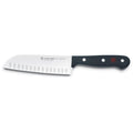 5 inch Wusthof gourmet hollow edge santoku knife displayed on a white background