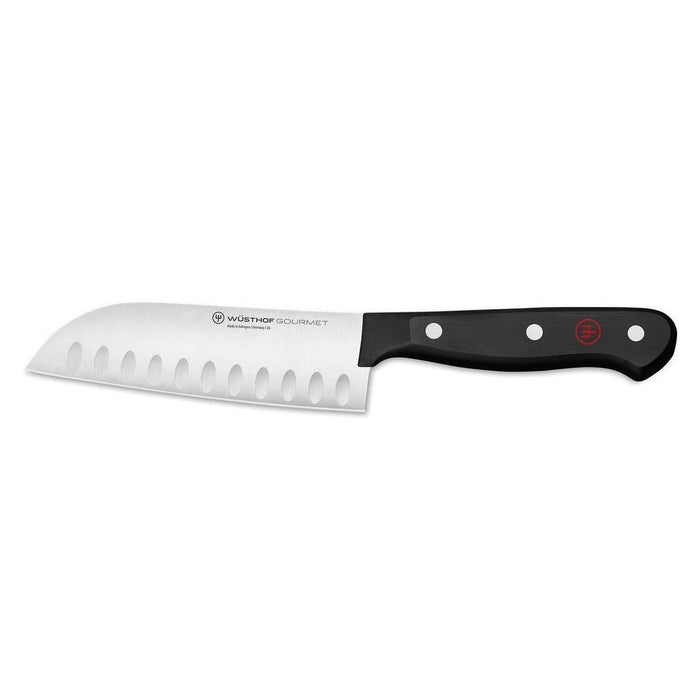 7 inch Wusthof gourmet hollow edge santoku knife displayed on a white background