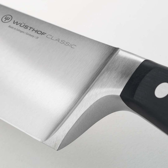 Close up of the hilt of 2.75 inch Wusthof gourmet trimming knife displayed on a white background