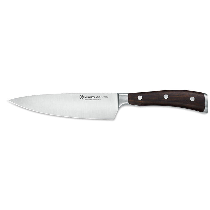 6 inch Wusthof Ikon blackwood chef knife displayed on a white background