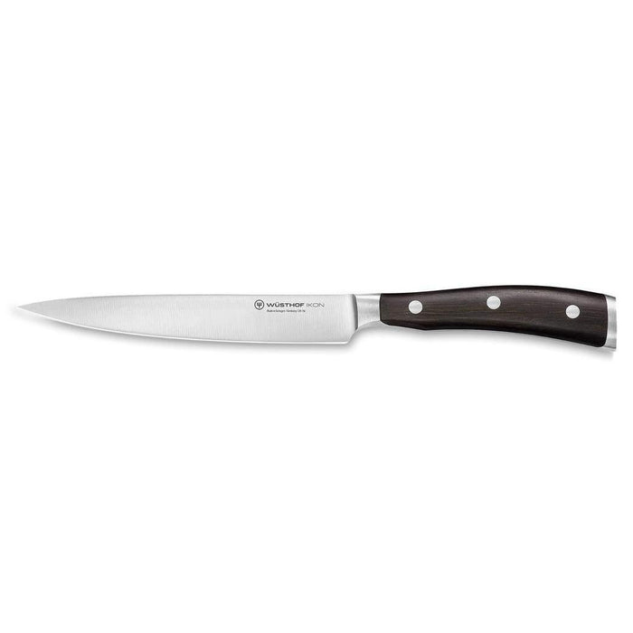 6 inch Wusthof ikon blackwood utility knife displayed on a white background