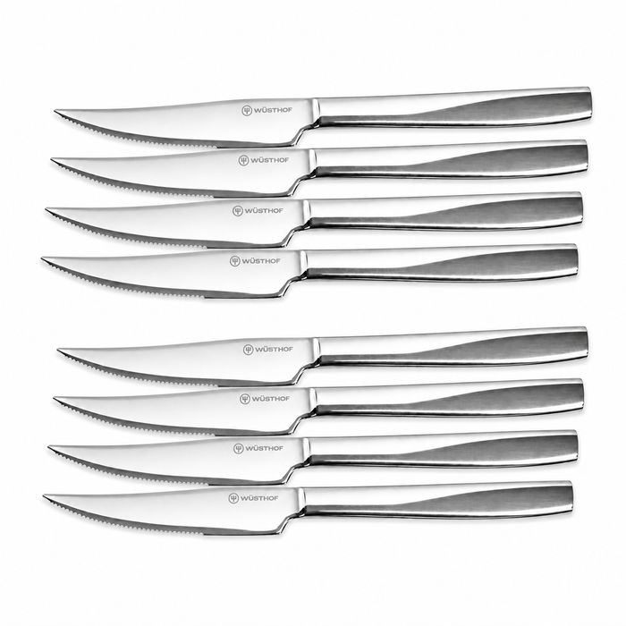 Set of eight Wusthof steak knives on a white background