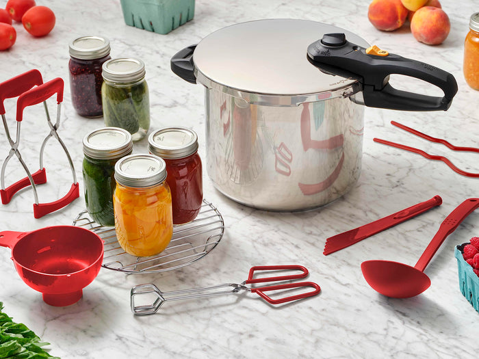 Zavor duo 8 piece pressure canning set on a countertop with canned pickled ingredients