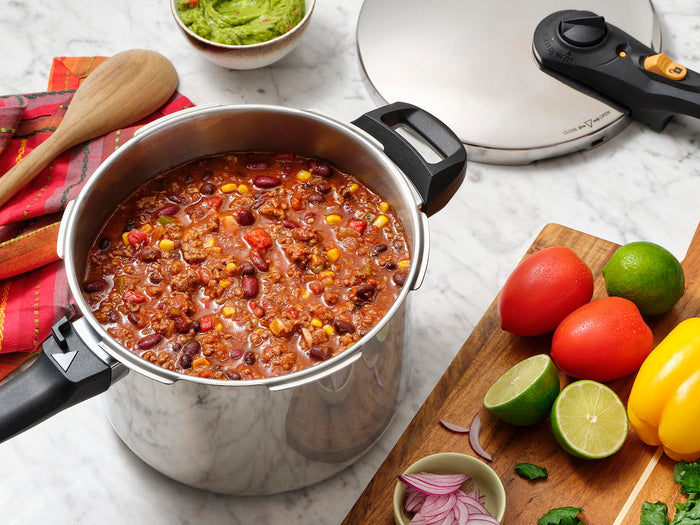 Zavor duo 8 piece pressure canning set on a countertop with prepped ingredients