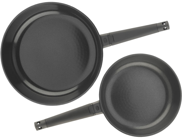 Zavor noir 10 & 12 inch skillet set next to each other with black handles on a white background