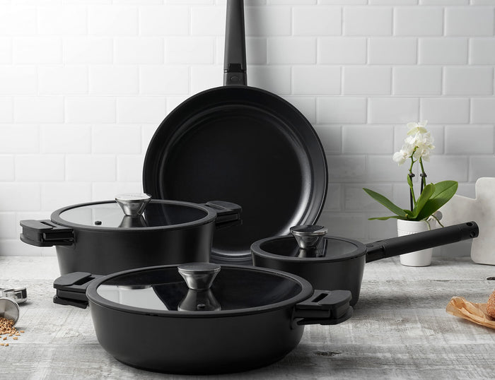 Zavor Noir 7 piece cookware set displayed on a wooden surface