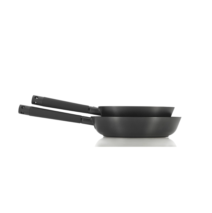 Side view of set of Zavor noir 8 and 10 inch skillet stacked on each other displayed on a white background